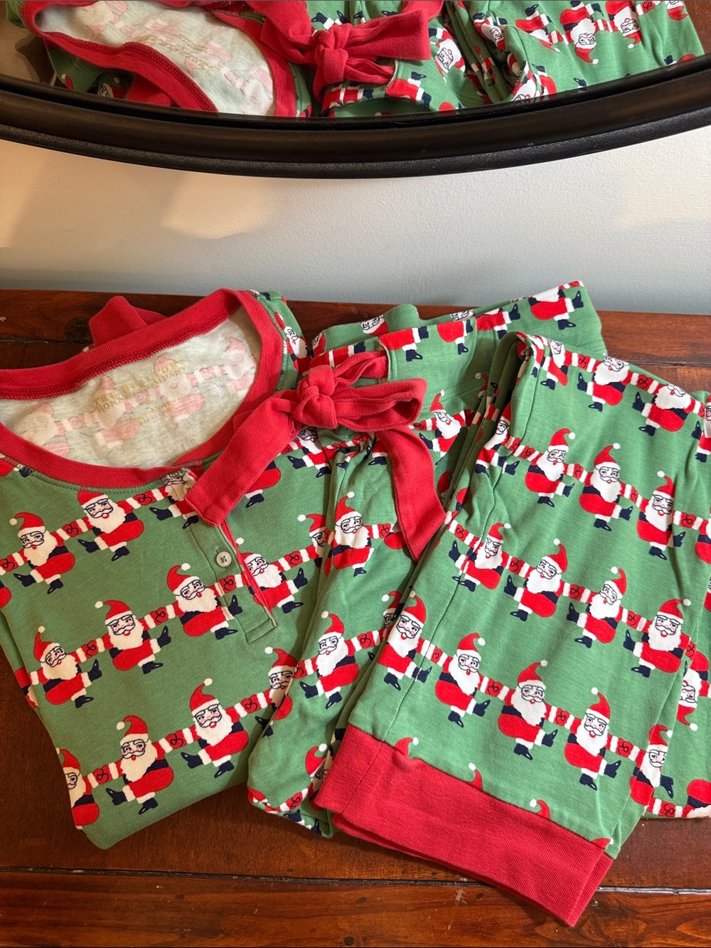 The Beaufort Bonnet Company Green Santa Print Kids Pajama Set with Red Trim
